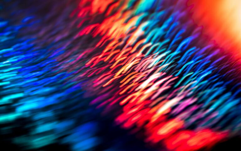 Dynamic abstract composition with vivid colors and light streaks, creating a cyberpunk aesthetic.