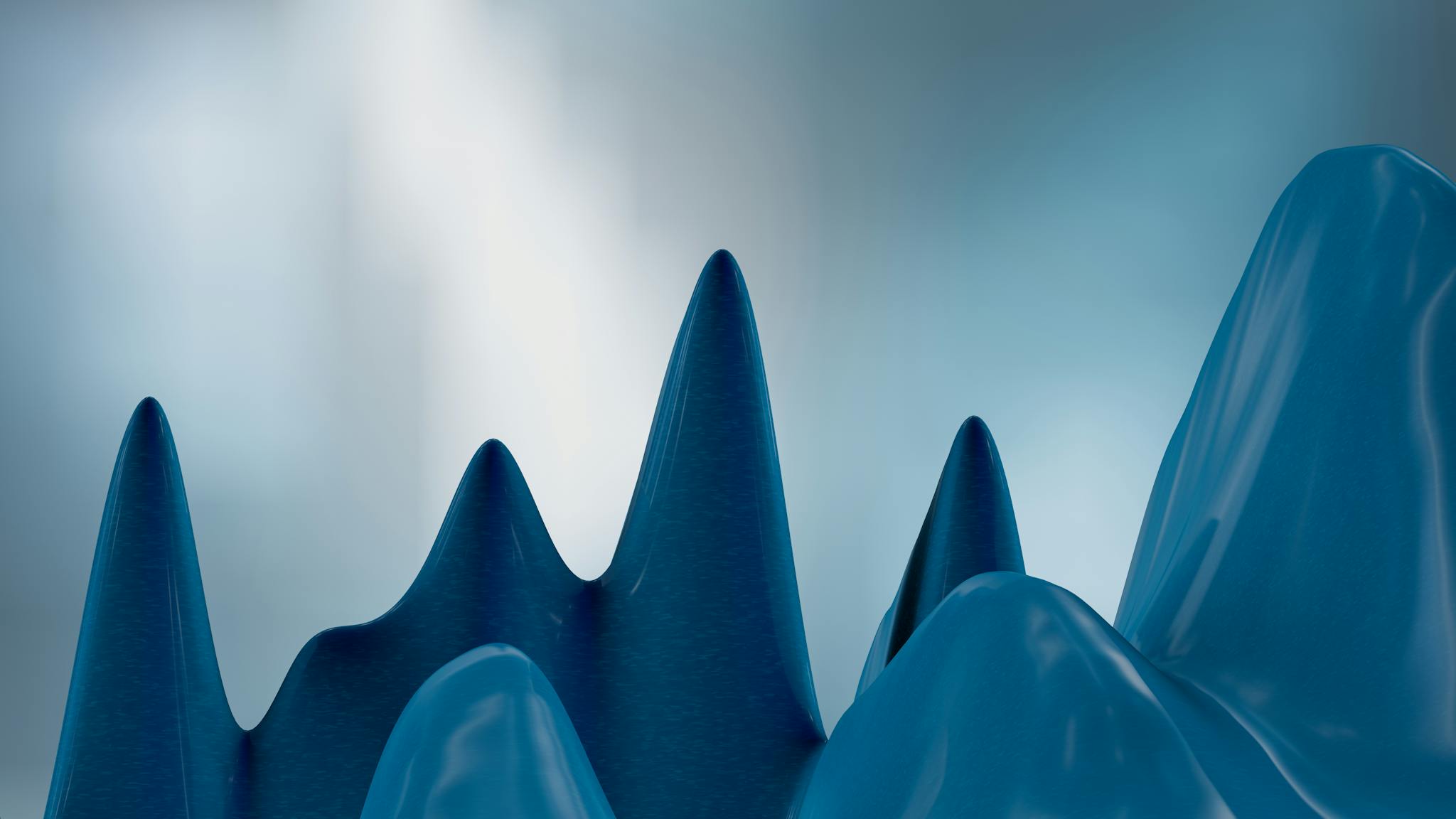 Sleek 3D render of blue peaks with a gradient background, conveying modern abstract art.
